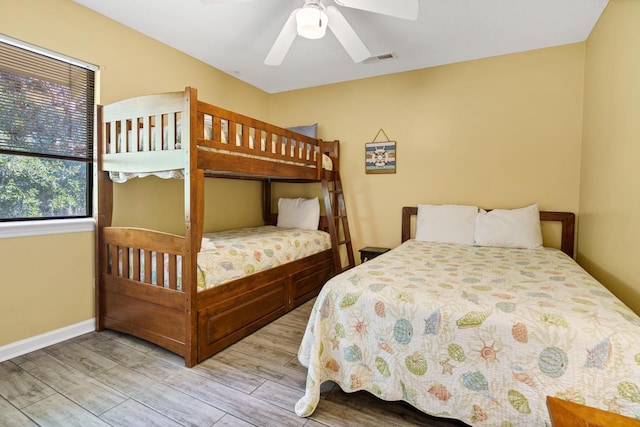 bedroom with ceiling fan and light hardwood / wood-style floors