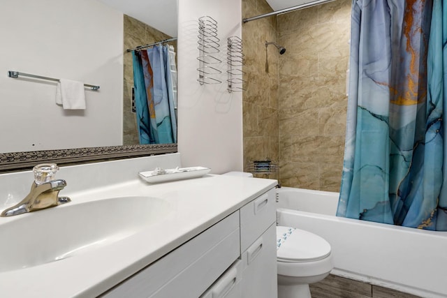 full bathroom featuring wood-type flooring, vanity, toilet, and shower / bathtub combination with curtain