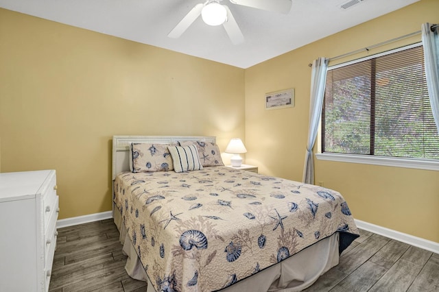 bedroom featuring dark wood-type flooring and ceiling fan