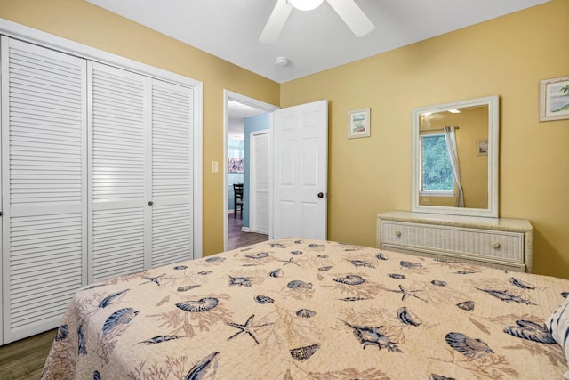 bedroom featuring ceiling fan, a closet, and hardwood / wood-style floors