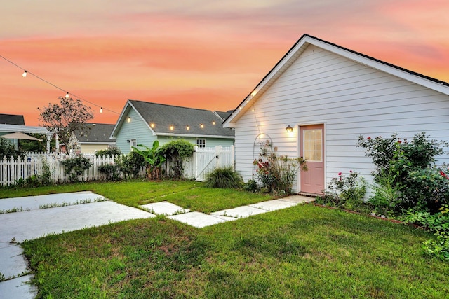 rear view of property featuring a gate and a patio
