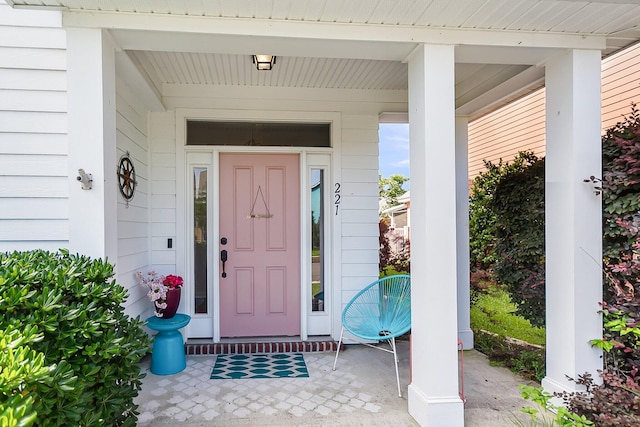 entrance to property featuring a porch