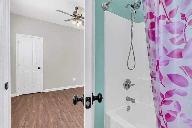 full bathroom with a ceiling fan, wood finished floors, shower / tub combo with curtain, and baseboards