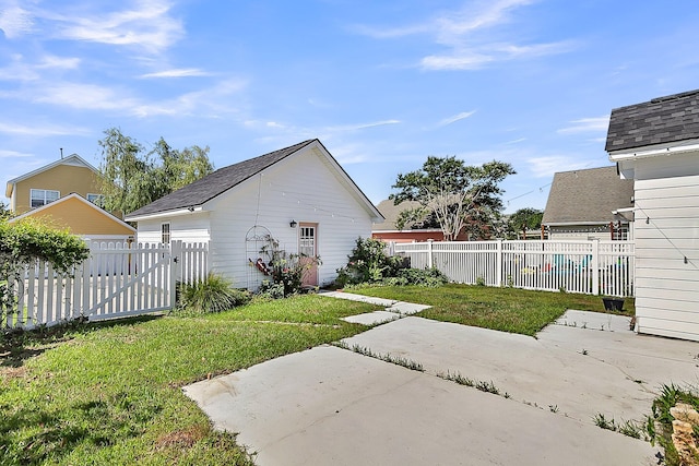 view of yard featuring a patio and a gate