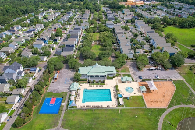 aerial perspective of suburban area featuring a pool area