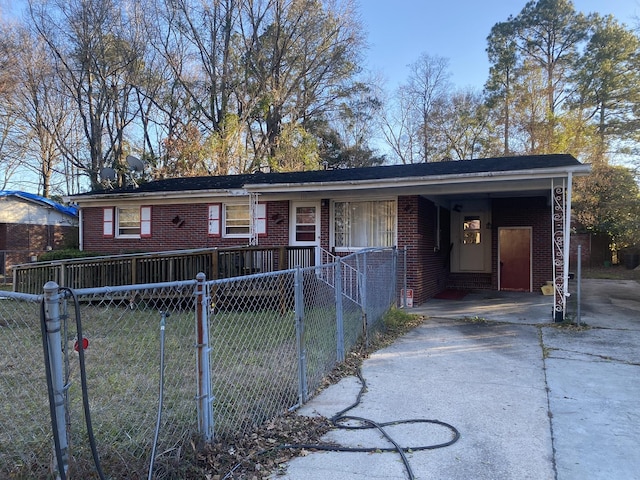 single story home featuring a carport and a front yard