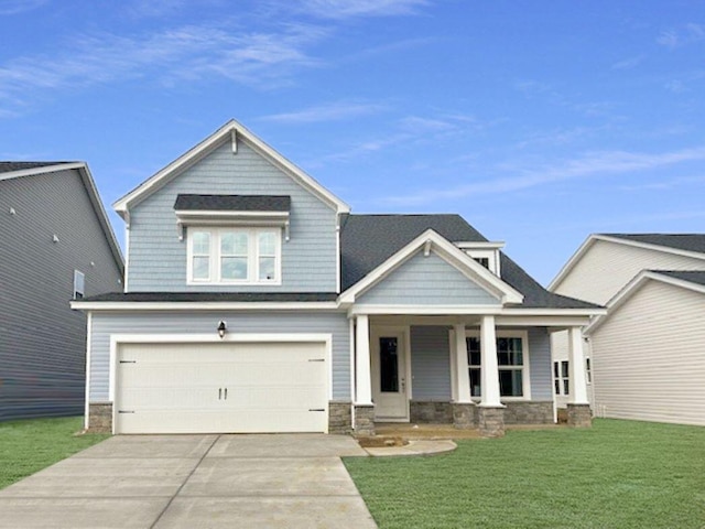 137 Winding Grove Ln, Moncks Corner, SC 29461 - craftsman house featuring a porch, concrete driveway, a front lawn, a garage, and stone siding