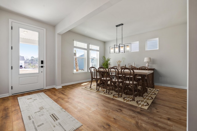 137 Winding Grove Ln, Moncks Corner, SC 29461 - dining room with wood-type flooring, baseboards, and a chandelier