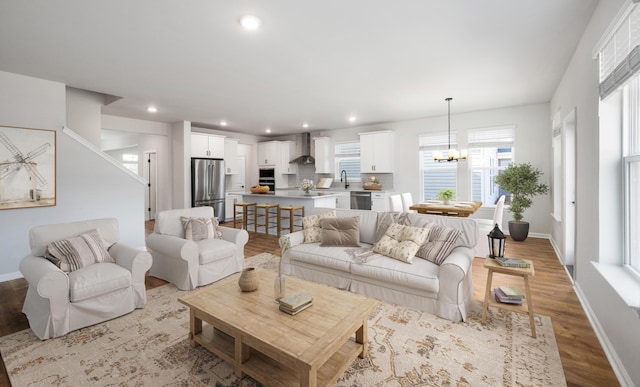137 Winding Grove Ln, Moncks Corner, SC 29461 - living area featuring a chandelier, light wood finished floors, baseboards, and recessed lighting