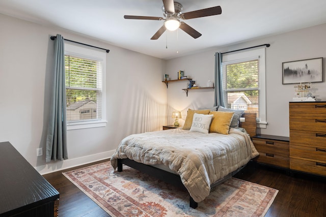 2924 Alabama Dr, North Charleston, SC 29405 - bedroom featuring multiple windows, dark wood-style flooring, ceiling fan, and baseboards
