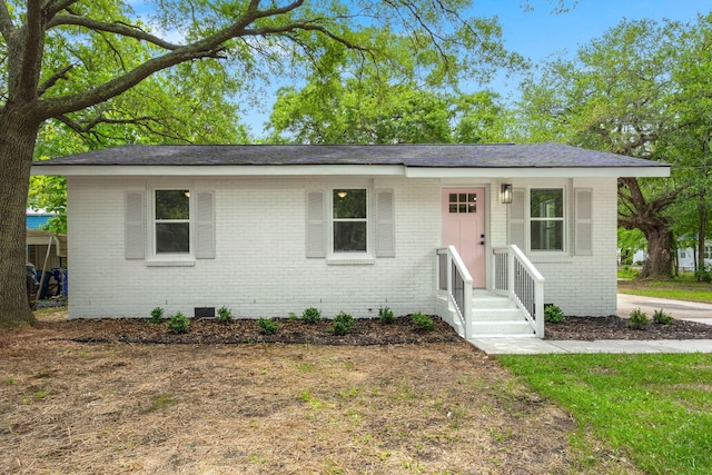 view of front of home featuring brick siding