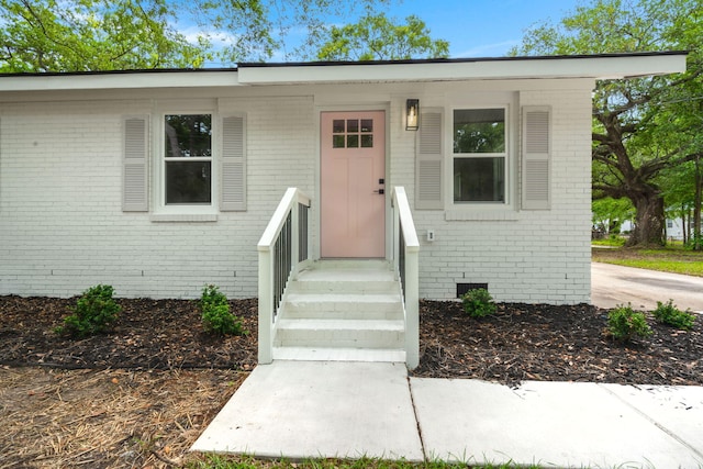 view of front of property featuring brick siding