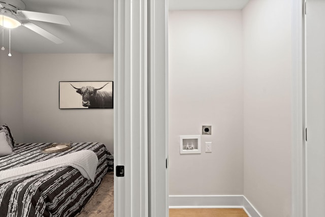 bedroom featuring a ceiling fan and baseboards