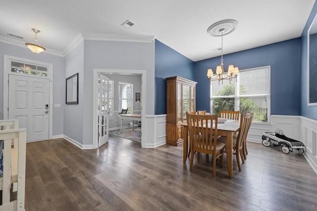 185 Red Leaf Blvd, Moncks Corner, SC 29461 - dining space with a chandelier, dark wood-style floors, wainscoting, crown molding, and a decorative wall