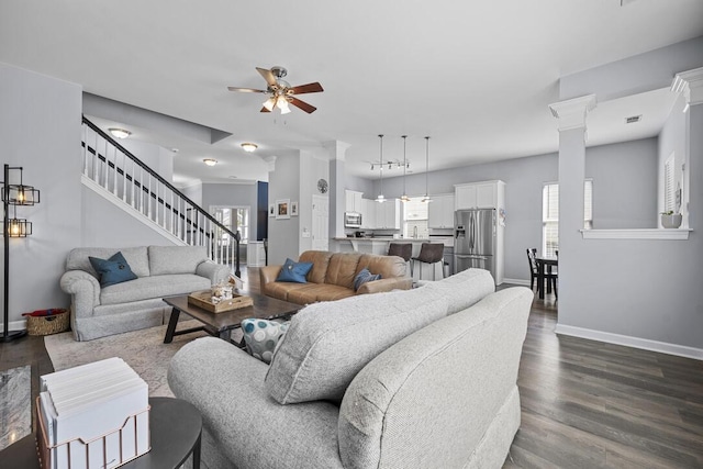 185 Red Leaf Blvd, Moncks Corner, SC 29461 - living room with a ceiling fan, dark wood-type flooring, baseboards, decorative columns, and stairway