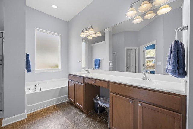 185 Red Leaf Blvd, Moncks Corner, SC 29461 - bathroom featuring double vanity, a bath, a chandelier, and baseboards