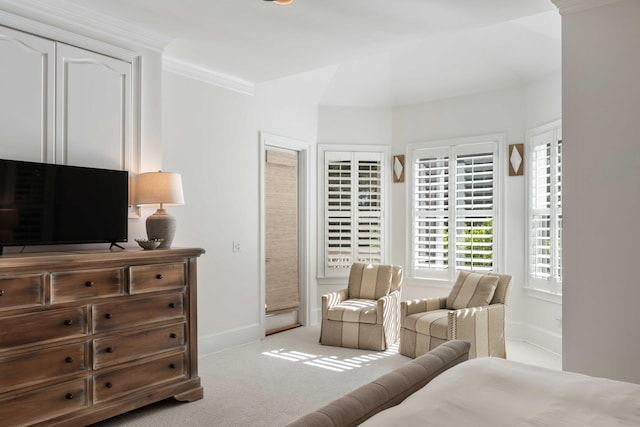 bedroom featuring crown molding, carpet floors, and baseboards