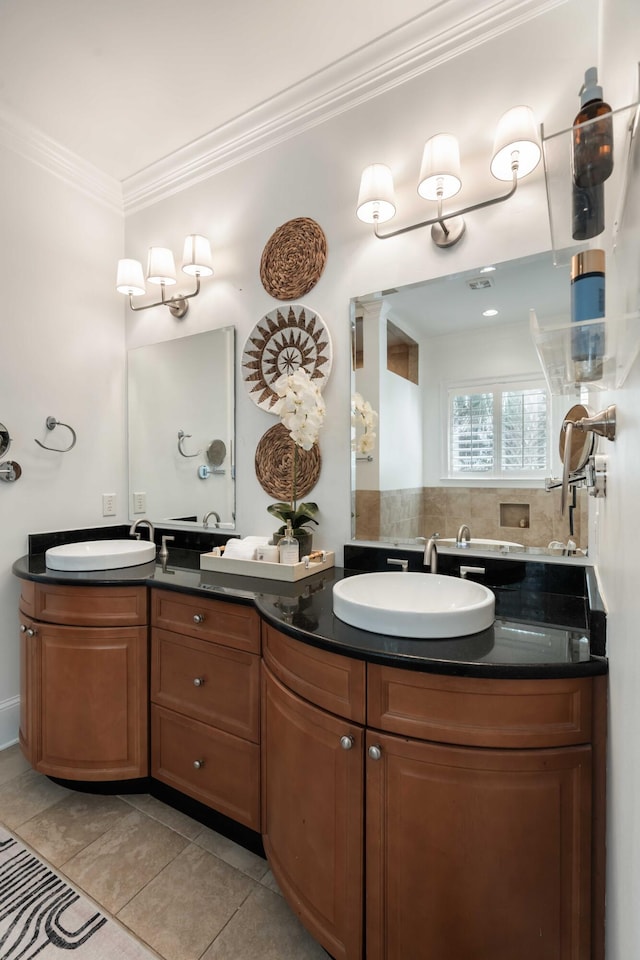 bathroom featuring a sink, crown molding, double vanity, and tile patterned floors