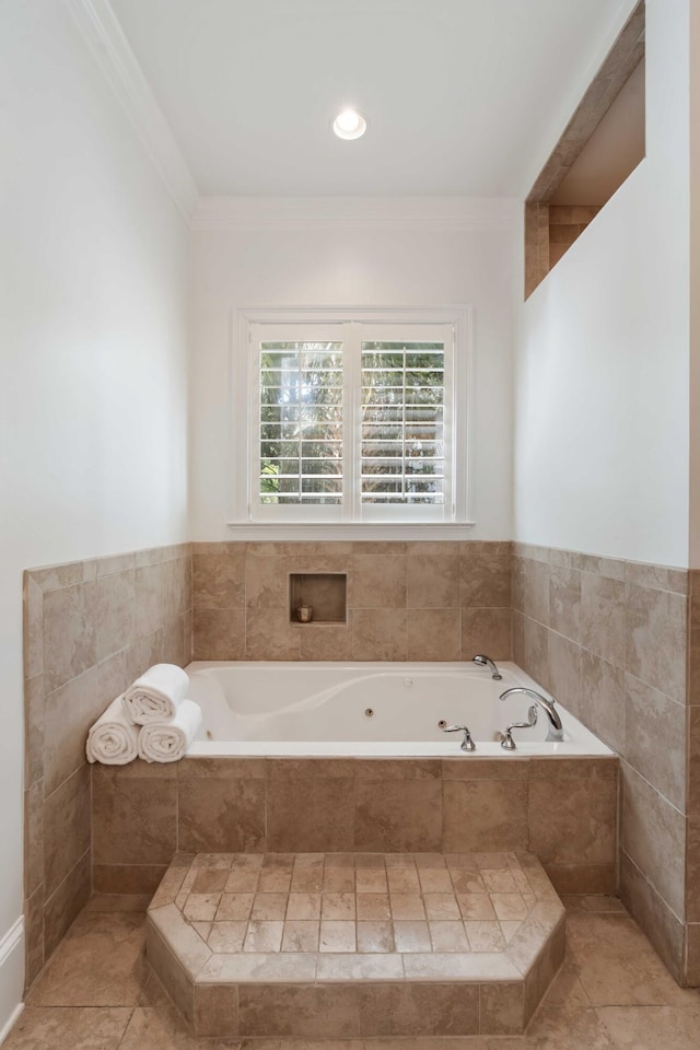 full bathroom with a tub with jets and ornamental molding