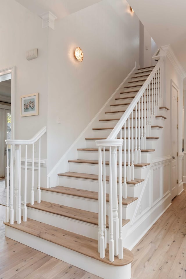 staircase featuring wood finished floors