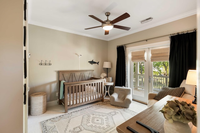 bedroom featuring french doors, baseboards, ornamental molding, visible vents, and carpet floors