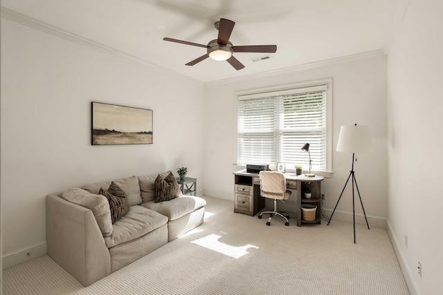office area with ceiling fan, crown molding, visible vents, and light colored carpet