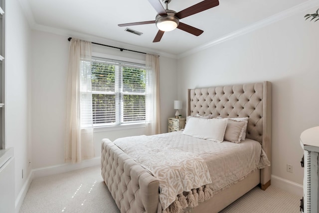 bedroom featuring ornamental molding, carpet, visible vents, a ceiling fan, and baseboards