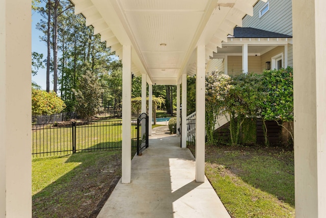 view of patio featuring covered porch and fence