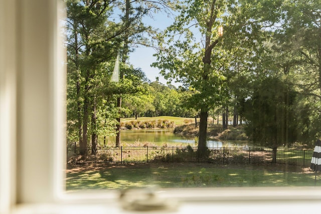 property view of water featuring fence