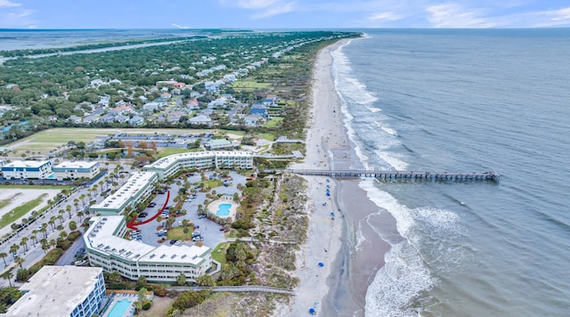 bird's eye view featuring a water view and a beach view