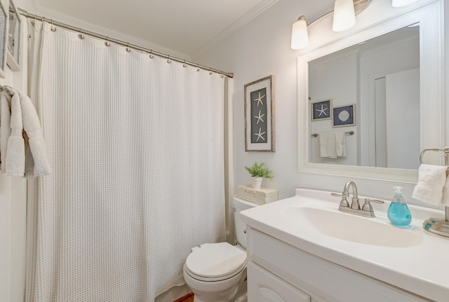 bathroom with ornamental molding, a shower with curtain, vanity, and toilet