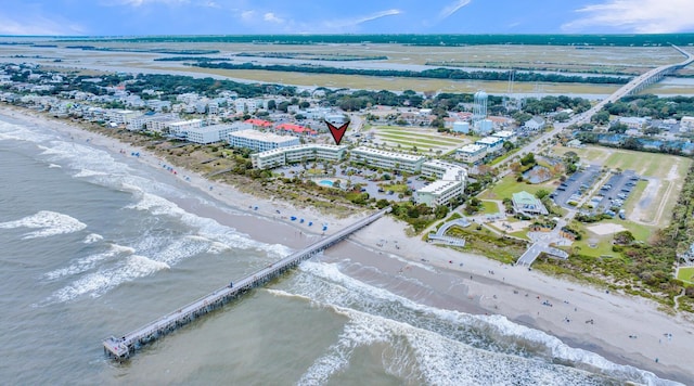 bird's eye view with a water view and a view of the beach