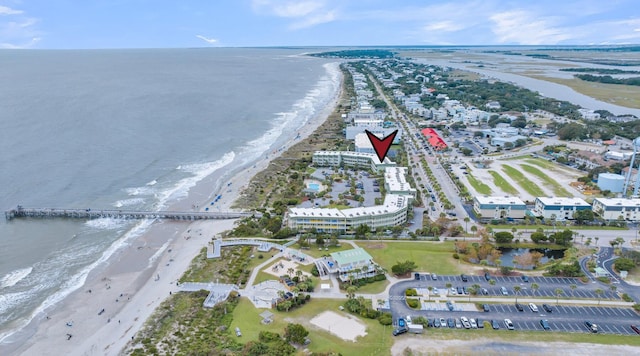 bird's eye view featuring a water view and a view of the beach