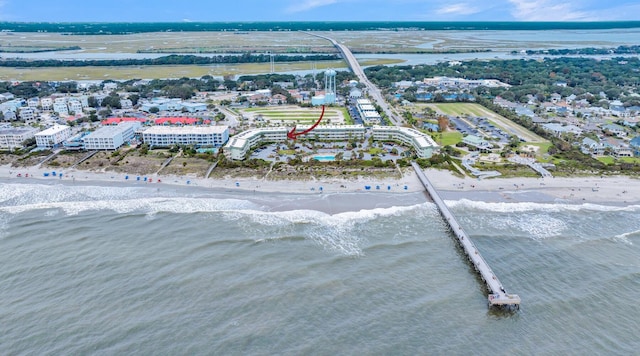 drone / aerial view with a water view and a view of the beach