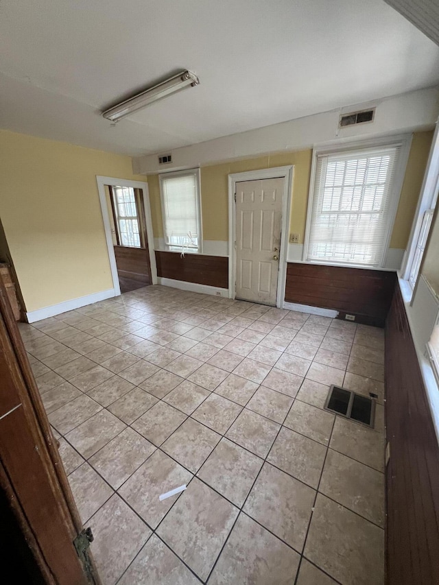 foyer entrance featuring light tile patterned flooring