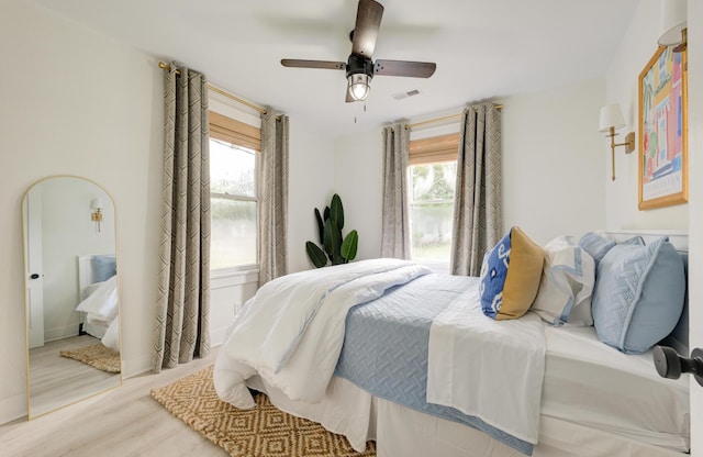 2317 Kent Ave, North Charleston, SC 29405 - bedroom with multiple windows, wood finished floors, and ceiling fan