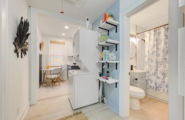 2317 Kent Ave, North Charleston, SC 29405 - laundry room featuring stacked washer / drying machine, light wood-style floors, and recessed lighting