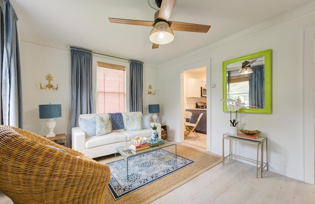 2317 Kent Ave, North Charleston, SC 29405 - living room with ceiling fan, light wood finished floors, ornamental molding, and baseboards
