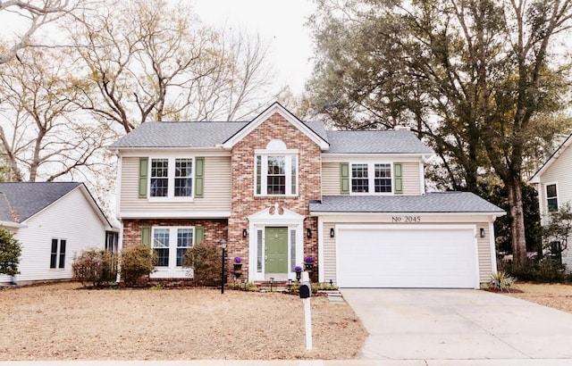 view of front facade with a garage, concrete driveway, brick siding, and a shingled roof