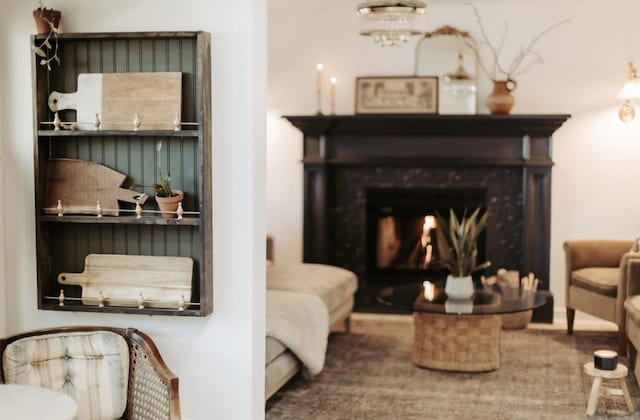 sitting room featuring a high end fireplace