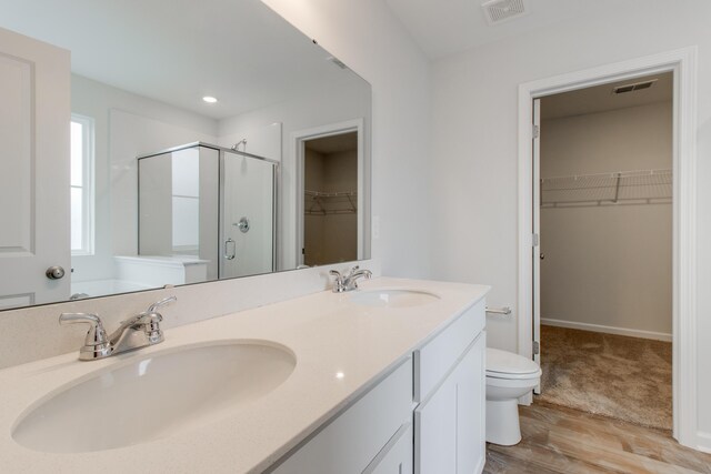 1816 Casein St, Summerville, SC 29483 - bathroom with visible vents, a sink, a stall shower, and toilet