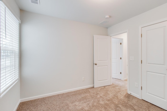 1816 Casein St, Summerville, SC 29483 - spare room featuring baseboards, light carpet, and visible vents