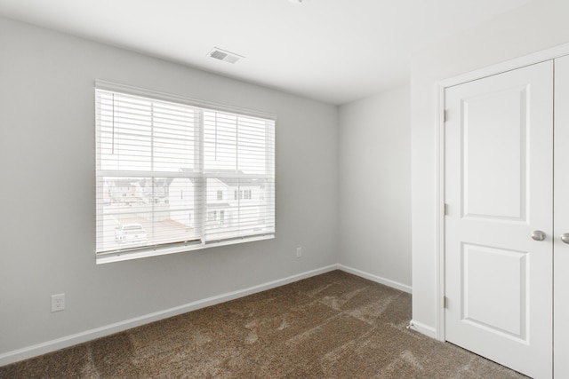 1816 Casein St, Summerville, SC 29483 - unfurnished room featuring baseboards, dark colored carpet, and visible vents