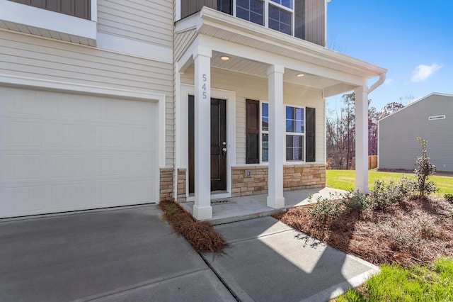 1816 Casein St, Summerville, SC 29483 - doorway to property with covered porch, concrete driveway, stone siding, and a garage
