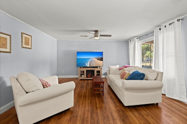 living room featuring dark hardwood / wood-style flooring and ceiling fan