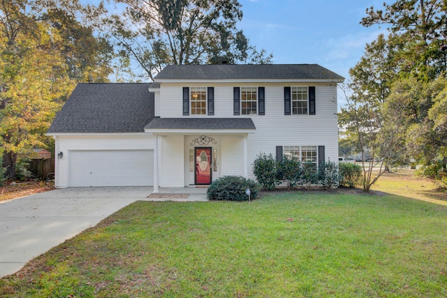 view of front of house featuring a garage and a front lawn