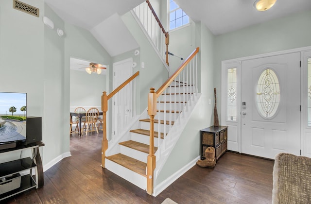 1600 Windsor Ln, Moncks Corner, SC 29461 - foyer entrance featuring dark wood-type flooring, high vaulted ceiling, stairway, ceiling fan, and baseboards