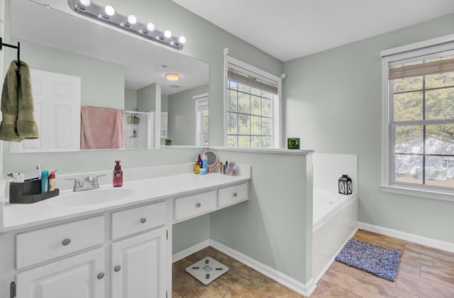 1600 Windsor Ln, Moncks Corner, SC 29461 - full bath featuring vanity, a bath, a shower with door, and baseboards