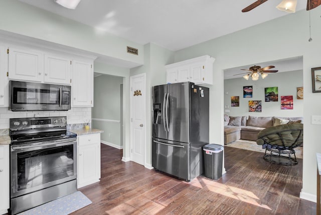 1600 Windsor Ln, Moncks Corner, SC 29461 - kitchen featuring appliances with stainless steel finishes, a ceiling fan, dark wood finished floors, and white cabinetry
