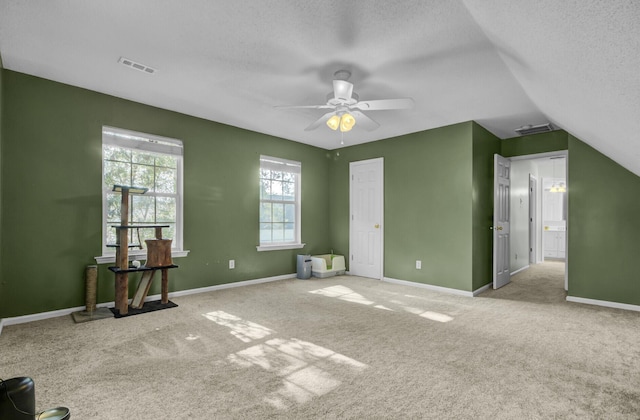 1600 Windsor Ln, Moncks Corner, SC 29461 - unfurnished bedroom with a textured ceiling, carpet floors, ceiling fan, baseboards, and lofted ceiling